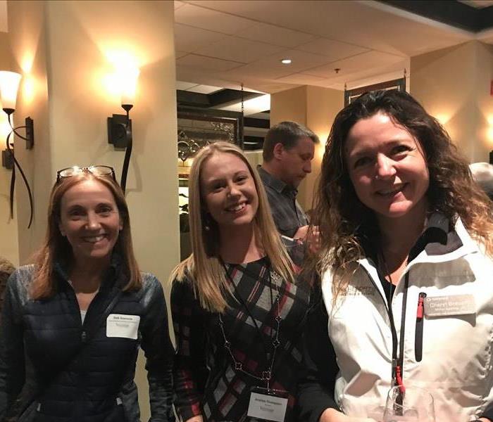 Three ladies at a networking event
