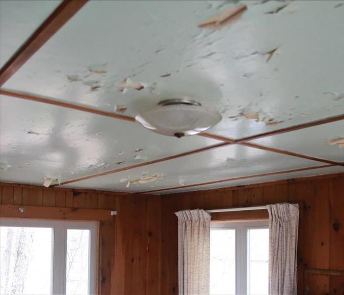 A ceiling with chipping paint